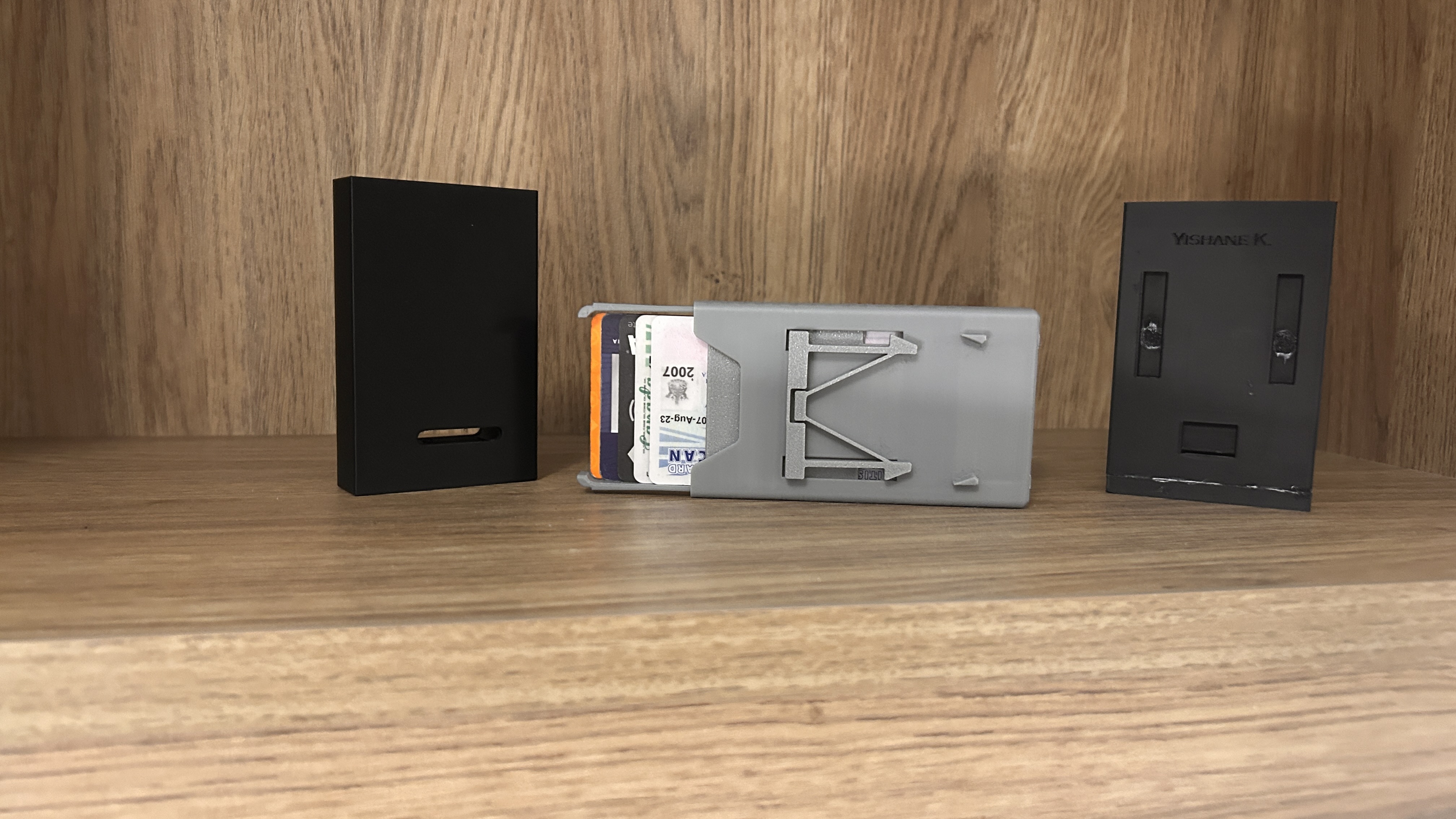Three wallet design iterations side by side